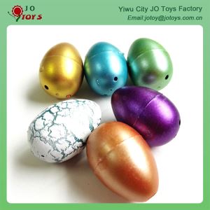 Nelielu dinozauru olas ūdens aug rotaļlietu tirdzniecības automātu nelielu plastmasas rotaļlieta